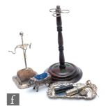 A silver plated hat pin stand with another turned wooden example, a Sterling silver pin tray, a