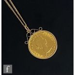 An Elizabeth II full sovereign dated 1967 loose to a 9ct pendant mount suspended from a 9ct fine