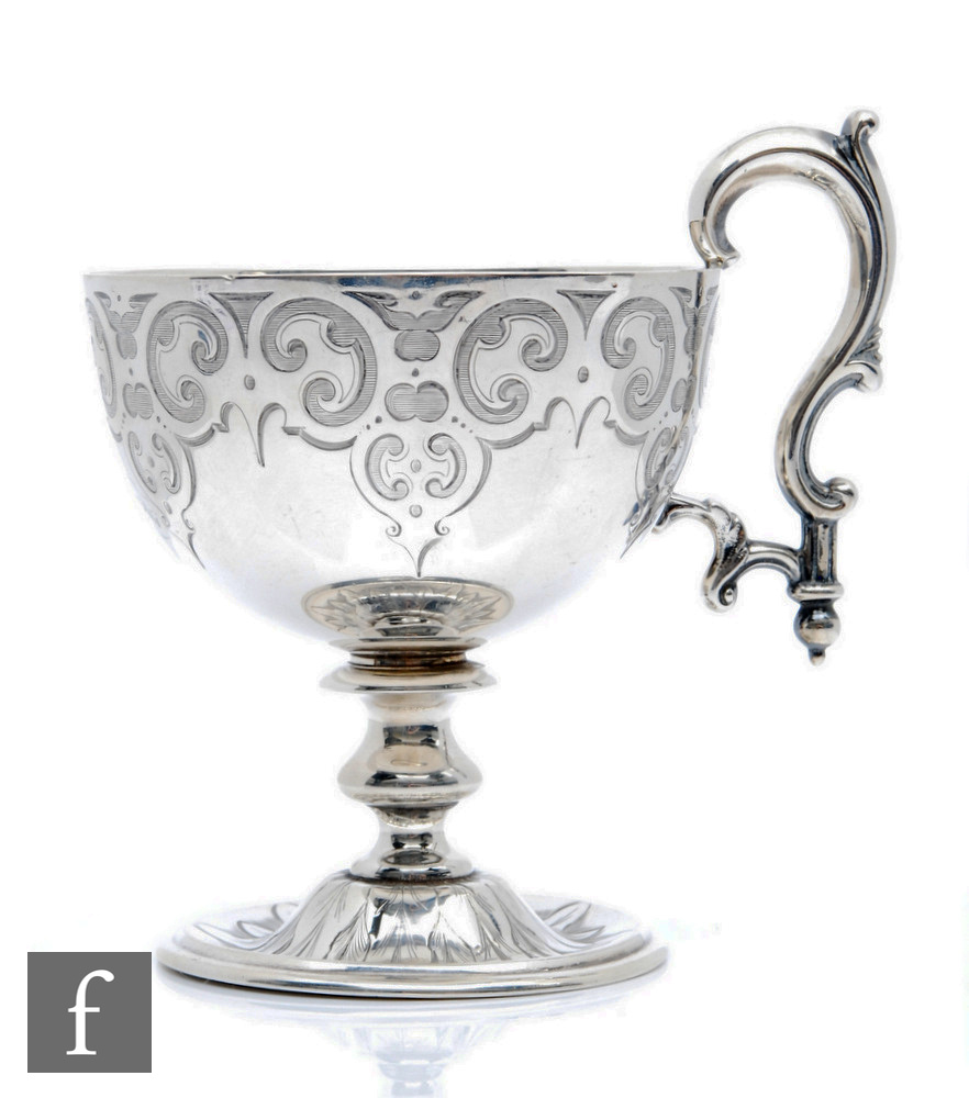 A Victorian hallmarked silver pedestal cup, circular foot below knopped stem and part foliate