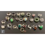 Twenty four assorted silver, white metal and other rings to include stone set and other examples. (