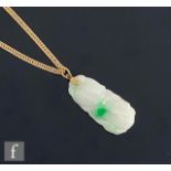 A 20th Century carved jade pendant, length 3.5cm, suspended from an 18ct flat curb link chain,