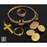 A small parcel lot of 9ct jewellery to include a pair of cufflinks, a hinged bangle, a ring and a