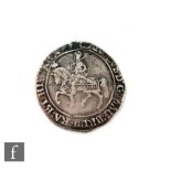 A Charles I half crown, sword over right shoulder, plain ground.