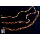 A 9ct mounted Baltic amber necklet comprising twenty five rectangular panels, length 40cm, with a