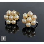 A pair of 9ct white gold, cultured pearl cluster screw fitting stud earrings, each comprising