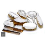 A parcel lot of hallmarked silver backed hair brushes, combs and hand mirrors, various styles and