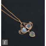 An early 20th Century 9ct open work pendant set with three heart shaped moonstones, length 3cm,