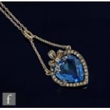 A 19th Century French silver heart shaped pendant with central paste blue stone within a white paste