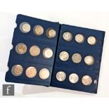 An album of coins from America, the Netherlands, Spain and South Africa, containing three Morgan