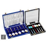 Two cased sets of six hallmarked silver teaspoons, one set with enamelled floral decoration to