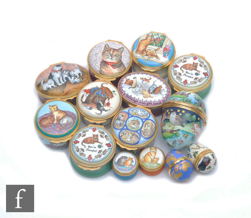 Fourteen cat themed Halcyon Days enamel pill boxes each decorated with scenes of cats to include two