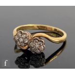 An early 20th Century 18ct diamond double head daisy cluster ring, weight 3.2g, ring size O.