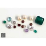 A small parcel lot of loose stones to include emeralds, diamonds, garnets etc. (19)
