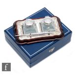 A modern hallmarked silver mounted turned wooden rectangular shaped desk set supporting twin
