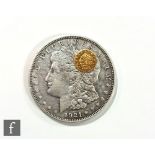 An American 1921 Morgan dollar with a Californian 1852 fractional gold coin. (2)