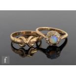 An 9ct opal and diamond daisy cluster ring, central opal within a diamond surround, one stone