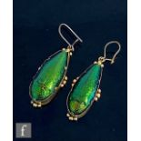A pair of Victorian gilt mounted scarab beetle drop earrings with shot detail to borders, weight 5.