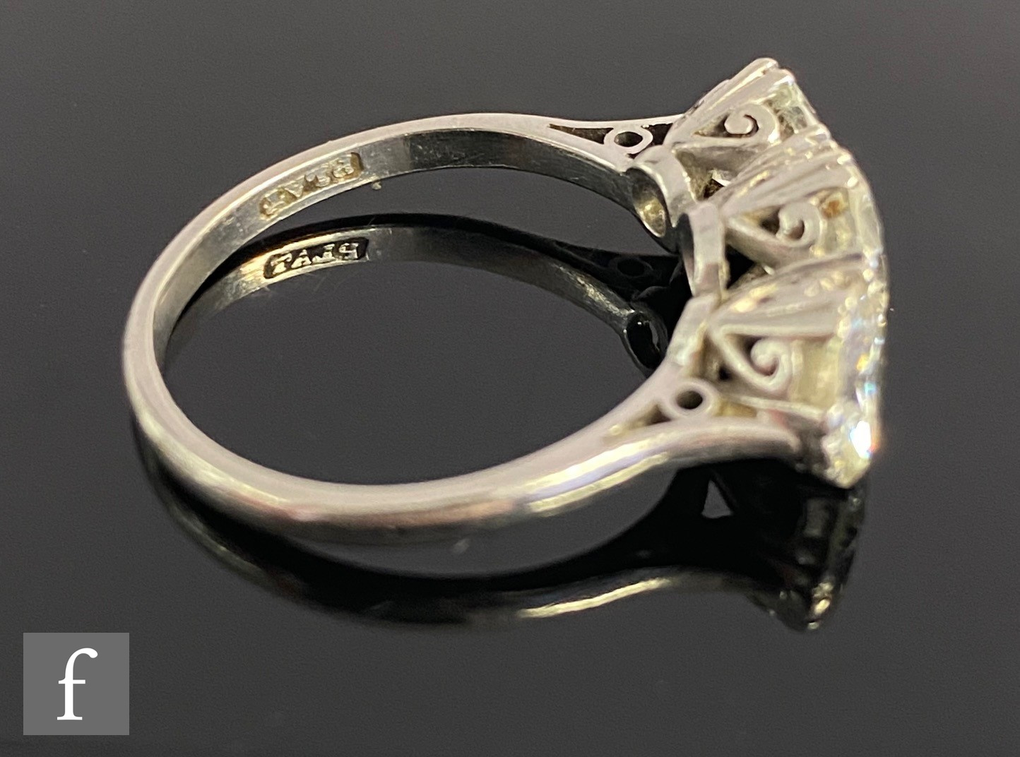 An platinum set diamond three stone ring, brilliant cut claw set stones, total weight - Image 4 of 5