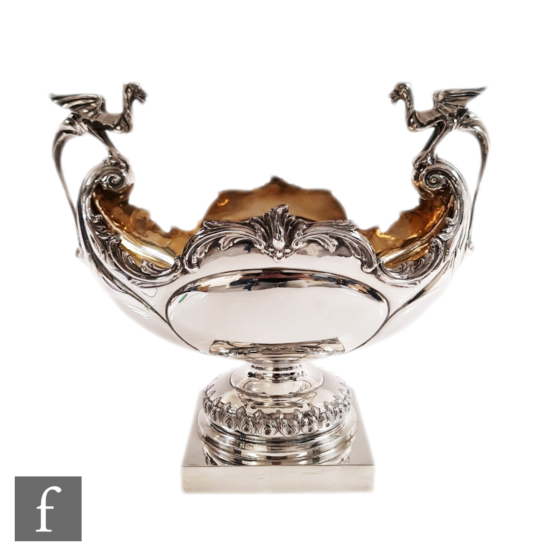 An early 20th Century hallmarked silver table centre piece, square base supporting boat shaped