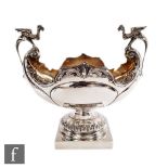 An early 20th Century hallmarked silver table centre piece, square base supporting boat shaped