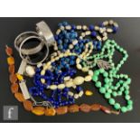 A small parcel lot of assorted beads and bangles to include lapis lazuli and other examples.