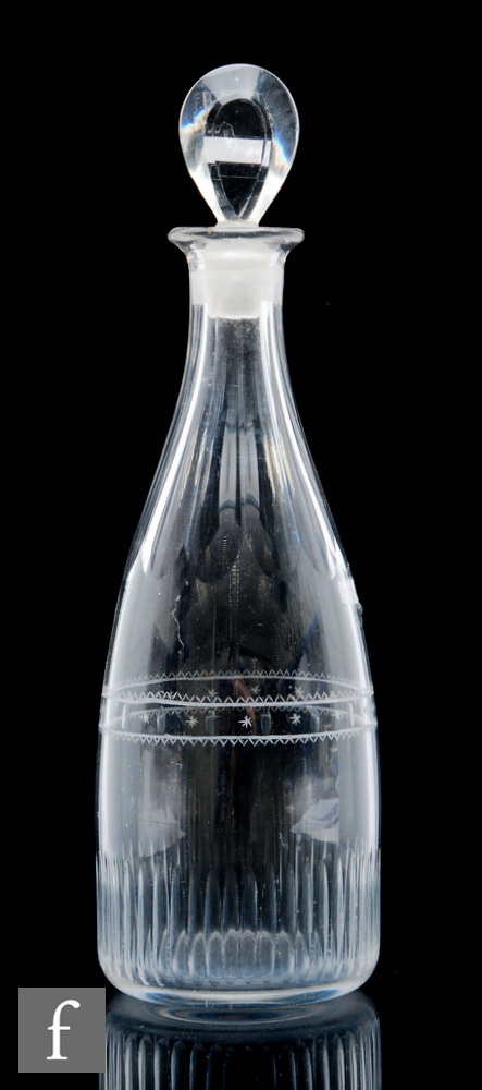 An 18th Century glass decanter of taper form, circa 1765-75, with fluted neck and base, the body