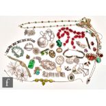 A parcel lot of assorted silver, costume and other jewellery to include a brooches, beads, a faux