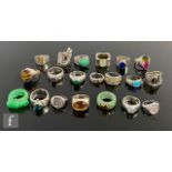 Twenty four assorted silver, white metal and other rings to include stone set and signet styles