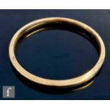 A 9ct hallmarked upper arm bangle of plain form, weight 16.5g, inner diameter approximately 8cm,