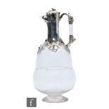 A Victorian hallmarked silver and clear glass claret jug, the glass body formed as an acorn, below