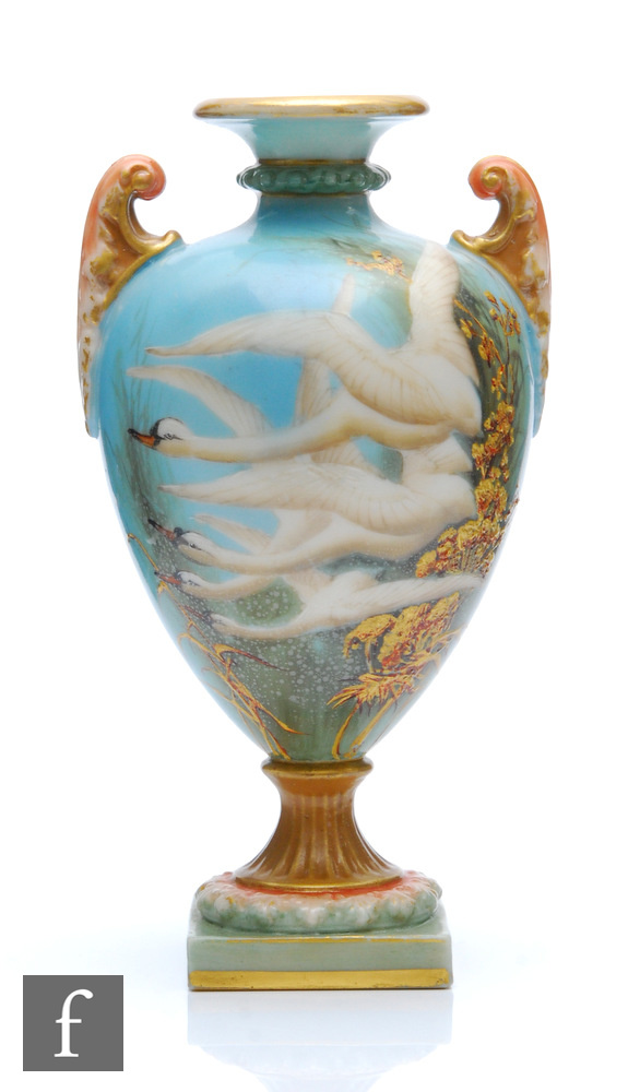 An early 20th Century Royal Worcester shape 2120 pedestal vase decorated by Charlie Baldwyn with