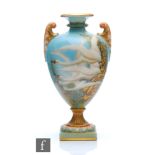 An early 20th Century Royal Worcester shape 2120 pedestal vase decorated by Charlie Baldwyn with