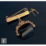 A 9ct mounted smoky quartz swivel fob suspended from a 9ct brooch fitting, total weight 36g,