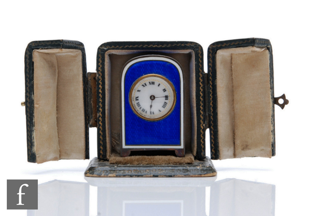 An early 20th Century French silver miniature boudoir clock, Roman numerals to a white enamelled