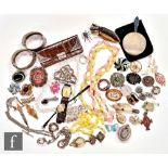 A parcel lot of assorted costume and other jewellery to include two silver bangles, beads, brooches,