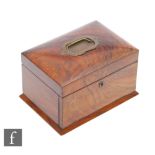 An early 20th Century walnut fall front jewellery box with brass handle to hinged lid opening to