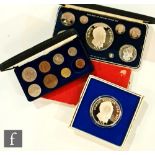 A Panama 1975 nine coin proof set, a 1975 twenty Balboas silver coin, a 1950 specimen set and a