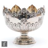 A hallmarked silver pedestal bowl, circular foot below part embossed and engraved body terminating