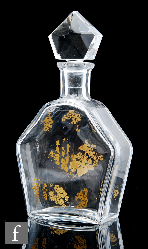 A Baccarat glass decanter, the hexagonal flat section body with gilded decoration of leaves and