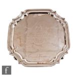 A hallmarked silver canted square salver with presentation engravings to Lieut Tom Jones, weight