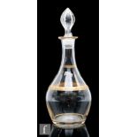 A Bohemian glass liqueur decanter, circa 1900, of baluster form, the body with a gilded band