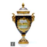 A Coalport twin handled vase and cover decorated with a hand painted cartouche scene of Langdale