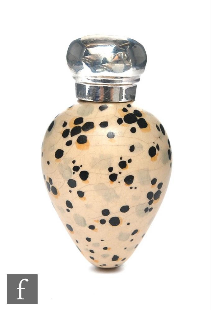 A late 19th Century hallmarked silver topped scent bottle modelled as a bird's egg with black and