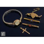 Three 9ct bar brooches with a 9ct crucifix, total weight 5.7g, and a 9ct lady's wrist watch, various