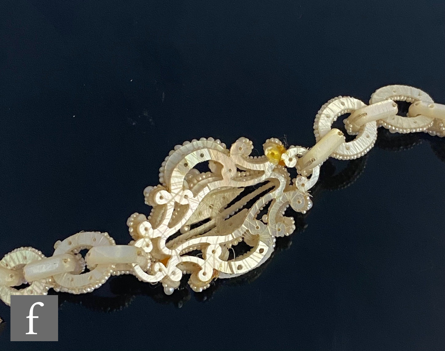 A cased 19th Century seed and mother of pearl choker comprising a central pierced cluster flanked by - Image 3 of 9