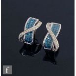 A pair of 14ct white gold blue and white diamond stud earrings, three rows of square cut blue