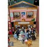 A two storey hinged front dolls house modelled as a shop, the ground floor as Hayes's Toy