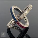 An early 20th Century silver red, white and blue paste set hinged night and day ring, ring size K.