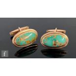 A pair of continental 9ct, single stone turquoise swivel cufflinks, oval matrix turquoise to a plain