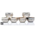 Six low grade Indian silver small bowls each decorated with a embossed hunting scene, total weight